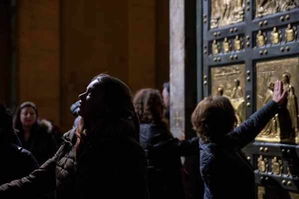 Artists cross the holy door on the night of February 16. Credit: Daniel Ibáñez/ Ewtn News