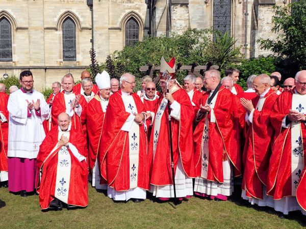 The new priest with the bishop and the other priests who attended the ordination. Credit: RC Diocese Of East Anglia via Flickr (CC BY-NC-SA 2.0)