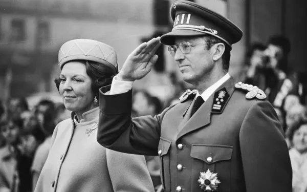 King Baudouin salutes during the performance of the Belgian national anthem, March 31, 1981. Credit: Marcel Antonisse/Anefo, CC0, via Wikimedia Commons.