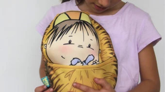 Niña con su “Baby Jesús”.