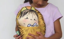 Niña con su “Baby Jesús”.