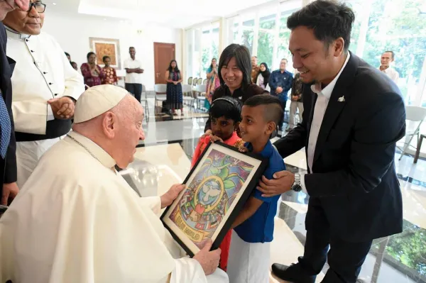 Pope Francis at the Apostolic Nunciature in Jakarta with refugee children. Credit: Vatican Media