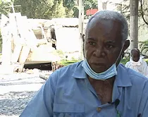 P. Augustin Almy en medio de los escombros del seminario en Puerto Príncipe