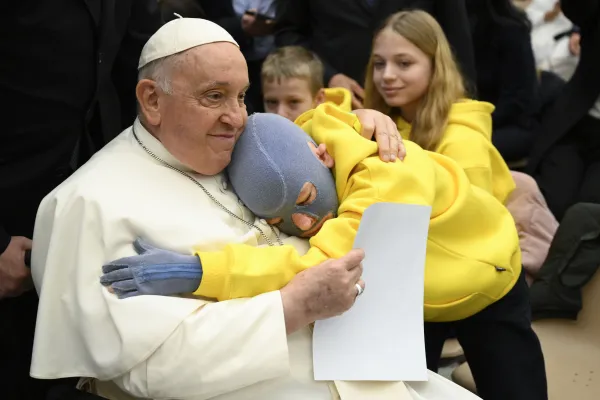 Emotional hug between Pope Francis and a sick child. Credit: Vatican Media